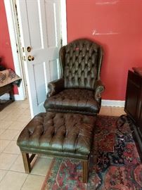 Awesome well loved leather chair with leather footstool.