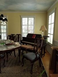 Beautiful oval dining room table and chairs with to extensions and custom pads available for immediate sale. Beautiful baby grand piano available for immediate sale.