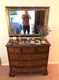 Mirror above chest & some costume jewelry on top