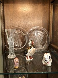 Lalique plates in background/ Herened small animals in foreground