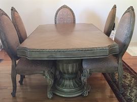 One view of the Michael Amini  Signature Series Dining Table with two extenders and six chairs