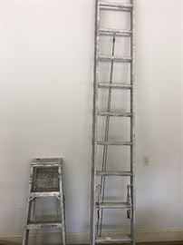 Tall extended ladder and a small ladder