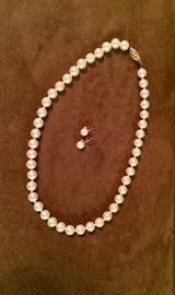 Another lovely pearl strand with earrings set in 14kt gold. 