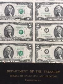 Sheet of uncut two dollar bills.