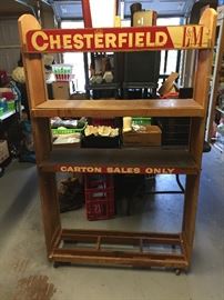 Old drug store chesterfield cigarett display on rollers. 