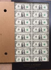Sheet of uncut one dollar bills.