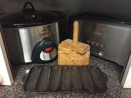 Breville long slot toaster, like new crock pot, cast iron cornbread pan. 