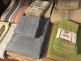 Lovely selection of table linens and napkins, some unused, all laundered and pressed. 