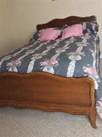 Antique full size bed, matching dresser with mirror, 2 night stands, and a chest of drawers