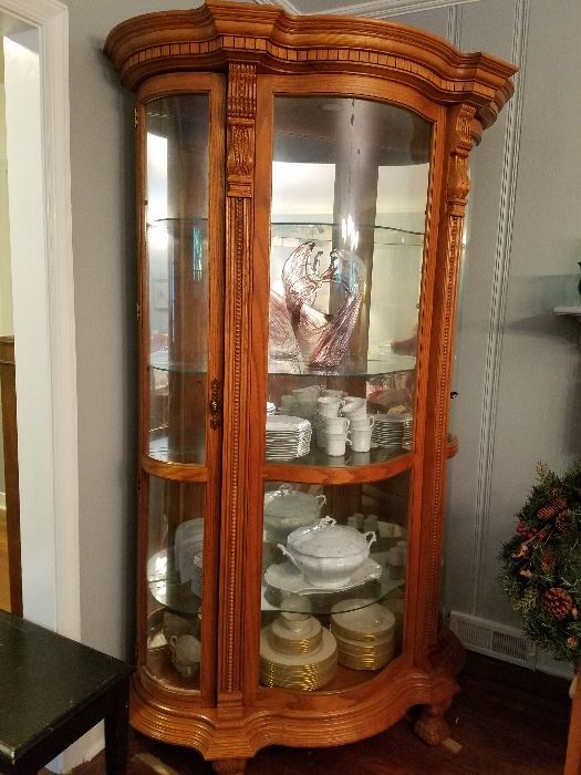 carved oak lighted curio cabinet