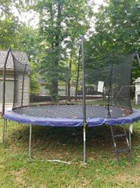 Large trampoline with safety net
