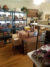 hundreds of books in house, garage, and outer building