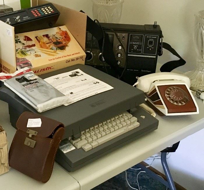 Lots of unique vintage items including digital typewriter and ribbon, rare vintage rotary phone, multiple pairs of vintage binoculars, several CB and multi-band radios / receivers (some not pictured)