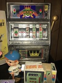 REAL working slot machine. Casino Crown. Works with or without quarters. Bell rings on payout. Lots of other vintage Las Vegas memorabilia and other fun barware and collectibles not shown. 