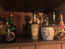 Lots of collectible bar ware and decor including vintage bottles