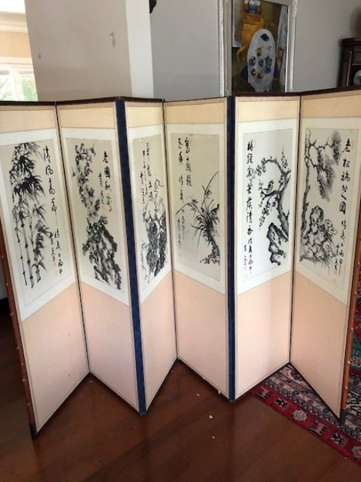 The home features many Chinese and Korean themed items, including this wall divider, painted with watercolor charcoal.