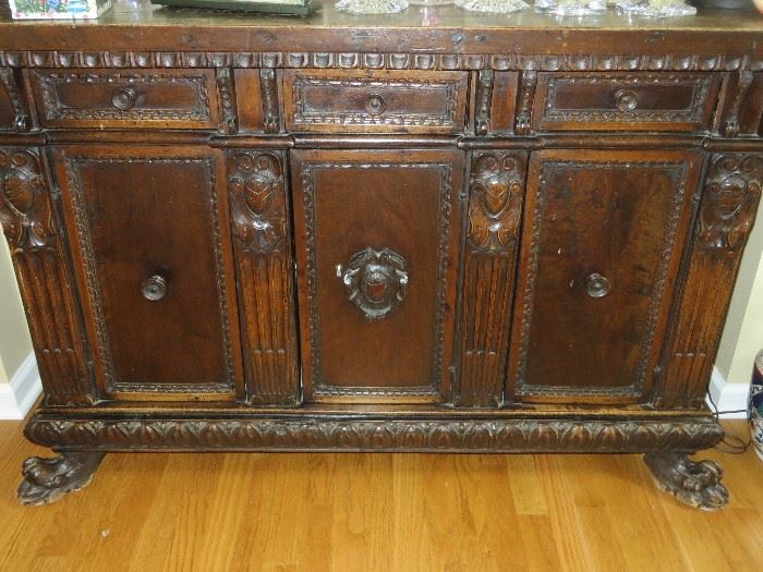 ANTIQUE 3 DOOR CABINET WITH CARVED COAT OF ARMS
ON CLAW FEET
