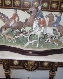 Lladro The Fox Hunt and French Louis XIV Rococo style carved, painted and gilded console table with matching mirror 