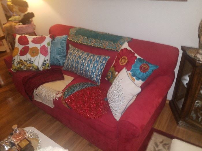 Red sofa and high end pillows and Pier 1 beaded runners