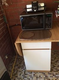 Small microwave and small drop leaf cabinet