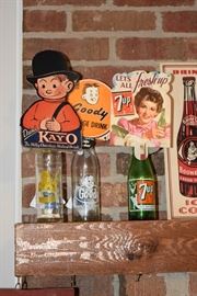 Vintage soda pop bottles and signs