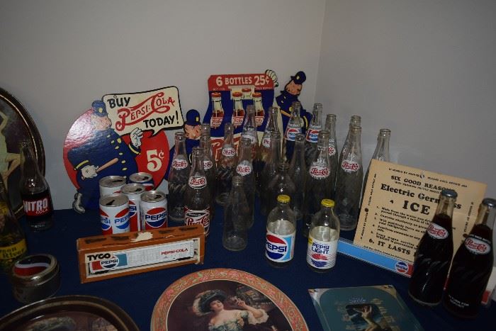 Vintage Pepsi bottles, signs