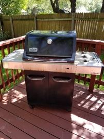 Weber grill  "Spirit" - includes grill cover. Inside is clean. 