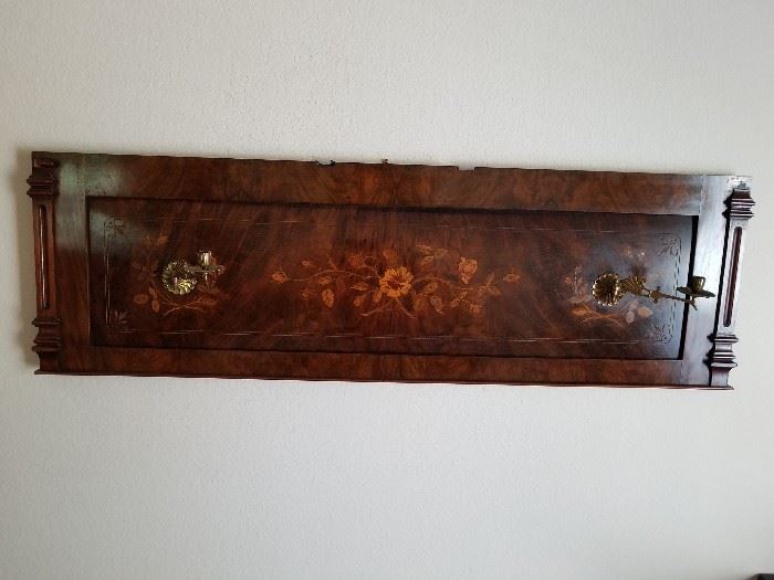This is a piece of an old player piano that has been converted into wall art. Looks great over a bed!