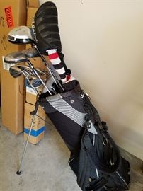 Golf clubs and bag. Clubs are Callaway Steelhead and Rawlings.
