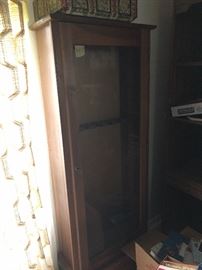 Glass front decorative gun cabinet with key, perfect condition.