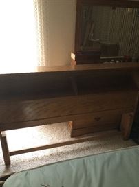 Full size bed frame with foot board, rails, and slats.