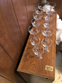 Vintage glass champagne glasses,  the 3 are shorter than the others.