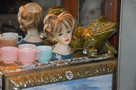 Beauty and the beast. We have three Lady Head Vases and three McCoy Frog planters.