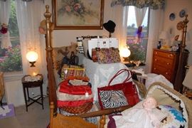 A pair of Fenton pink champagne hobnail lamps flank the full-size bed in the master bedroom. 