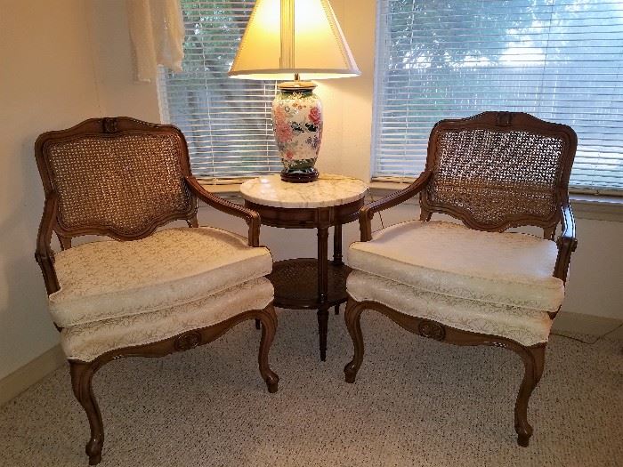 Pair of upholstered can back chairs