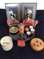 Lot 134: Samurai Art. Eclectic collection of Japanese art featuring Ningyo: Emperor and Empress for Hana matsuri Bamboo flower pictures Copper sake cups Cast iron samurai helmet Obi notebook Musical powder box5 candle trays Ikebana stand Lacquer bowl 5 dishes.       http://www.ctonlineauctions.com/detail.asp?id=731308