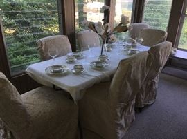8 dining chairs, six matching chair covers.