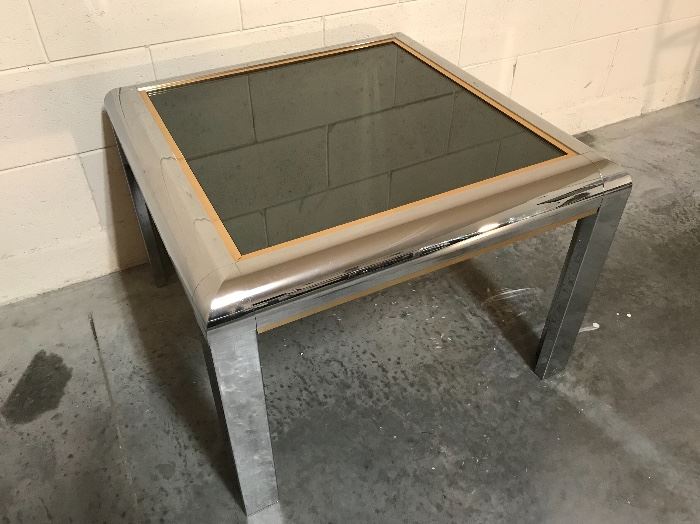 Unknown maker/designer, excellent condition chrome tables with smoke mirror-top glass, gold-color trim around, 2 available rectangle/square.. they are a pretty good size
