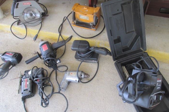 Miscellaneous power tools including heavy duty sander, drills, jig saw, power saw, 2 different sanders, vise (not shown), drill and more