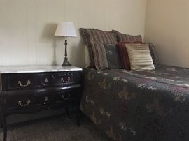 Reproduction Bombay bedside table's with marble tops. Beautiful hardware. Bedspread with matching cushions and bench.