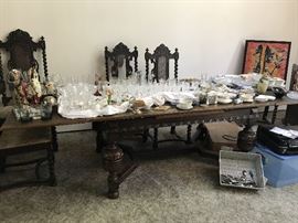 Fabulous heavily carved library/dining table. Leaves move out and up into place to extend to 10'.