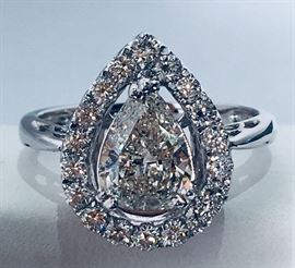 18 K white gold Ladies Diamond Ring - over one carat pear shaped diamond center stone with diamond surround