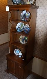 Collector plates on wood curio