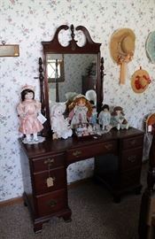 Vintage mahogany vanity and collectible dolls