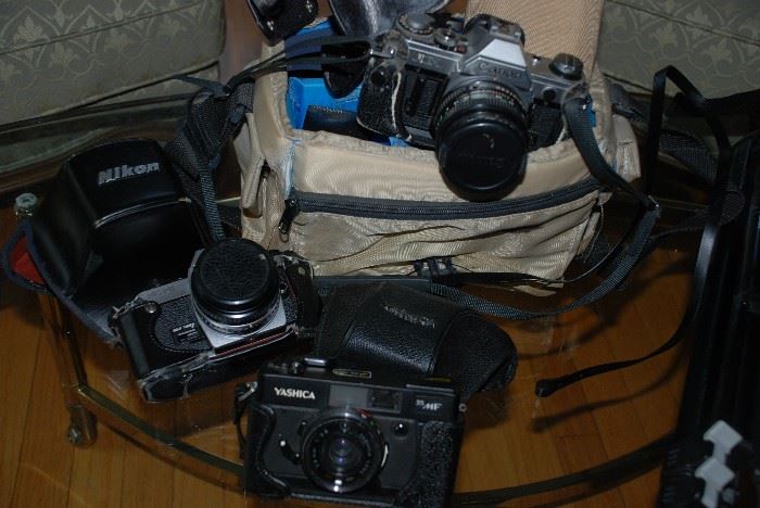 Vintage 35mm cameras; Nikon-FG-20, Yashica 35MF, Canon AE-1