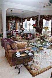 A Snip-it Of The Living and Dinning Room. Patch Work Pillow. $30.00. Patch Work Throws (2 available): $60.00ea. [Rug and Glass/Iron Coffee Table Stay w/The Family] 