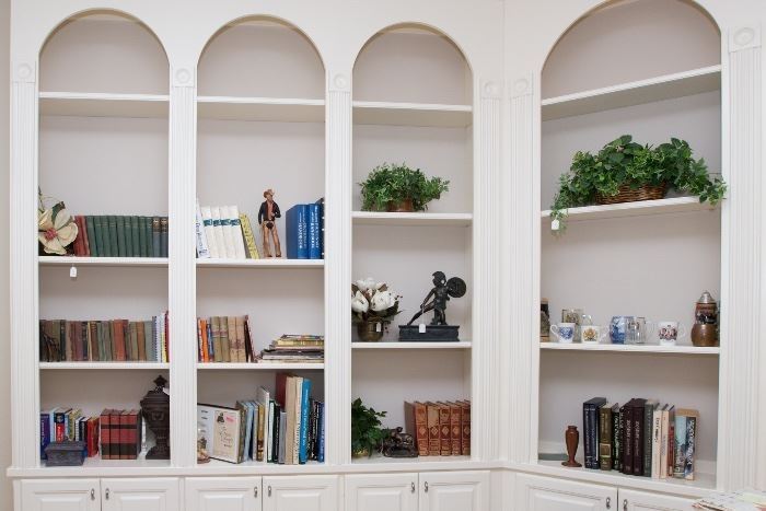 Such A Lovely Library.  Antique and Coffee Table Books, Art, Sculptures, Waterford Crystal Bookends, Royal Mugs and So Much More.  Plan To Make Time In Each Room Of The House.