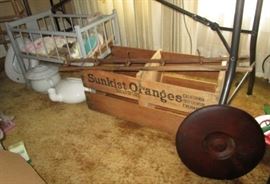 vintage doll crib, ceramic & enamel urinal, bedpan, wooden crock cover, Sunkist orange crate, antique wooden hat rack w/ folding iron hooks
