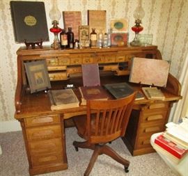 Antique roll top desk from Marshall's Dry Good store, Livingston County & Michigan Historical books, antique bottles, kerosene lamps!
