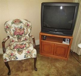Upholstered chair, TV and cabinet